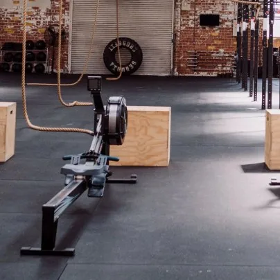 Rowing machine on the Synergy Fitness gym floor